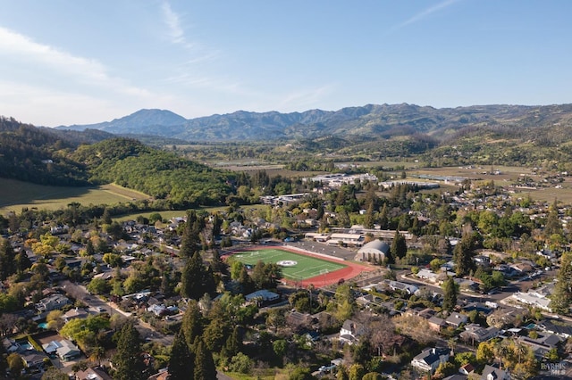 birds eye view of property featuring a mountain view