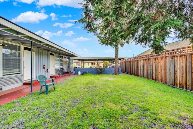 view of yard featuring a patio and a fenced backyard