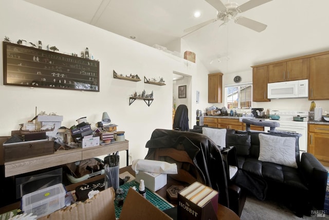 interior space featuring lofted ceiling and a ceiling fan