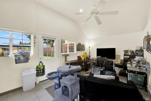 tiled office with high vaulted ceiling, baseboards, and a ceiling fan