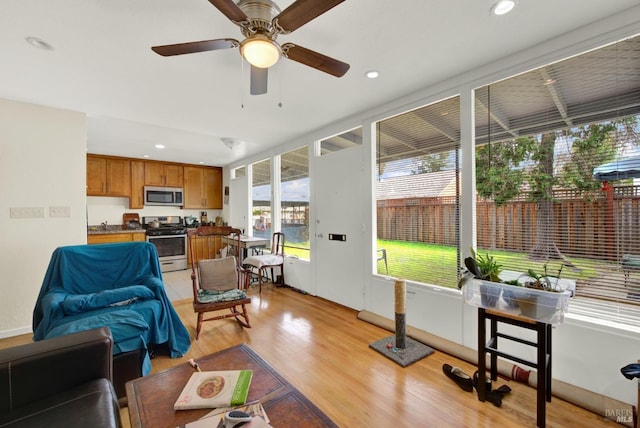 living area featuring recessed lighting and light wood-type flooring