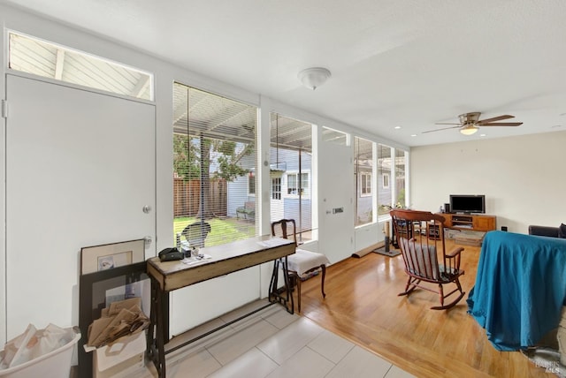 interior space with a ceiling fan