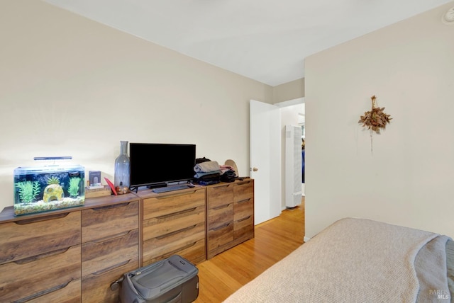 bedroom featuring wood finished floors