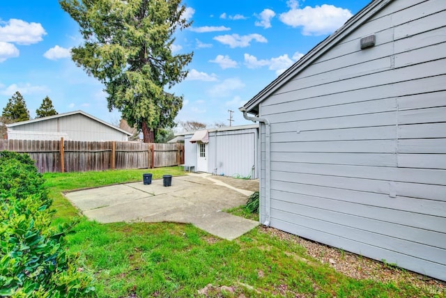 view of yard featuring a patio area and a fenced backyard