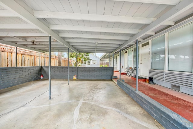 view of patio / terrace featuring fence and visible vents