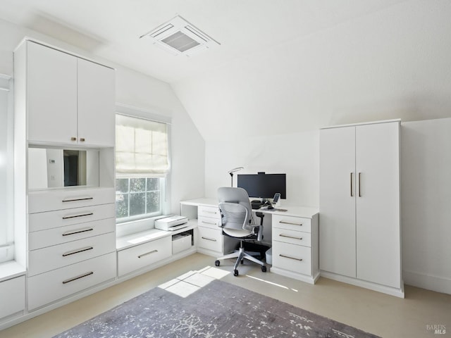 home office with visible vents, finished concrete flooring, and lofted ceiling