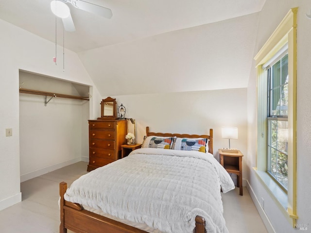 bedroom featuring vaulted ceiling, a ceiling fan, baseboards, and a closet