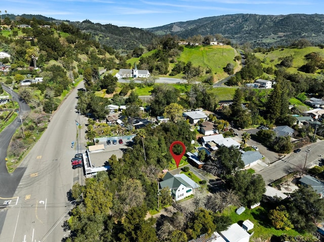 birds eye view of property with a mountain view