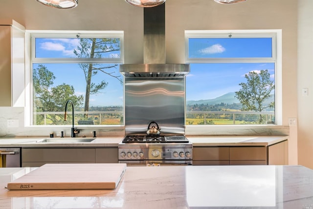 kitchen with a sink, stainless steel appliances, modern cabinets, and wall chimney exhaust hood