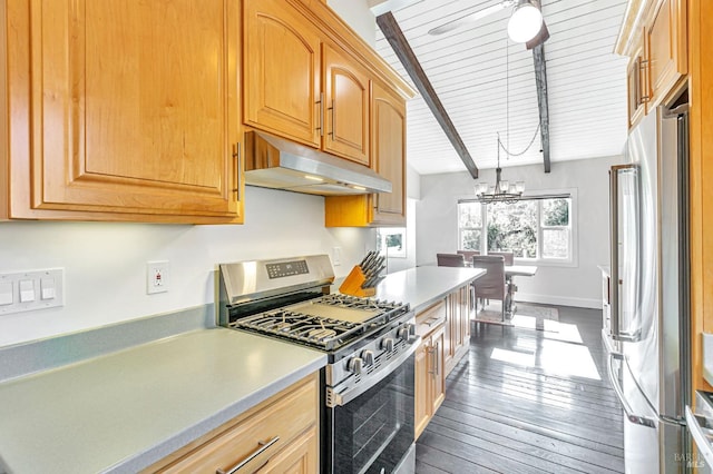 kitchen featuring appliances with stainless steel finishes, light countertops, and a sink