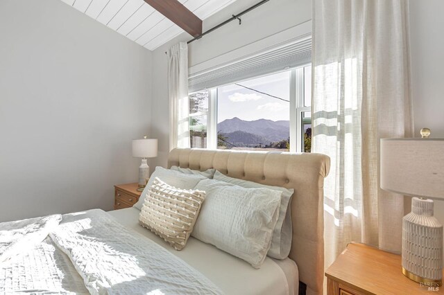 bedroom with baseboards, wooden ceiling, vaulted ceiling with beams, and dark wood-style flooring