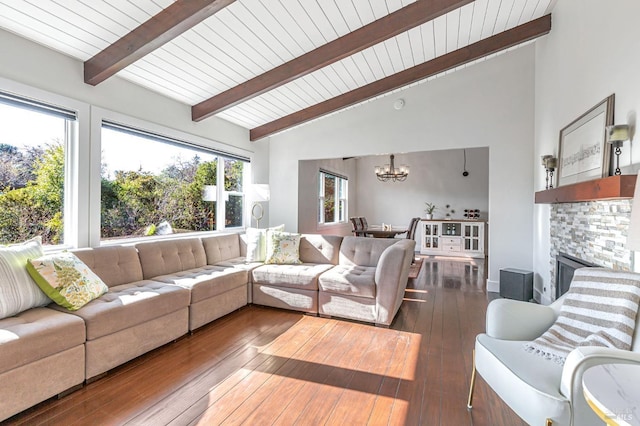 living area featuring wooden ceiling, a chandelier, a fireplace, lofted ceiling with beams, and wood-type flooring