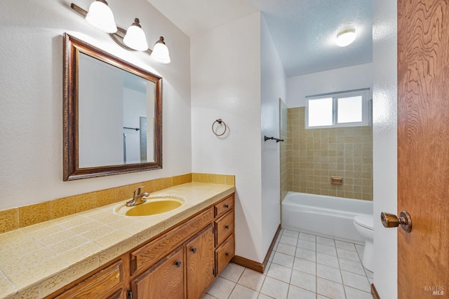 bathroom with vanity, baseboards, bathing tub / shower combination, tile patterned floors, and toilet