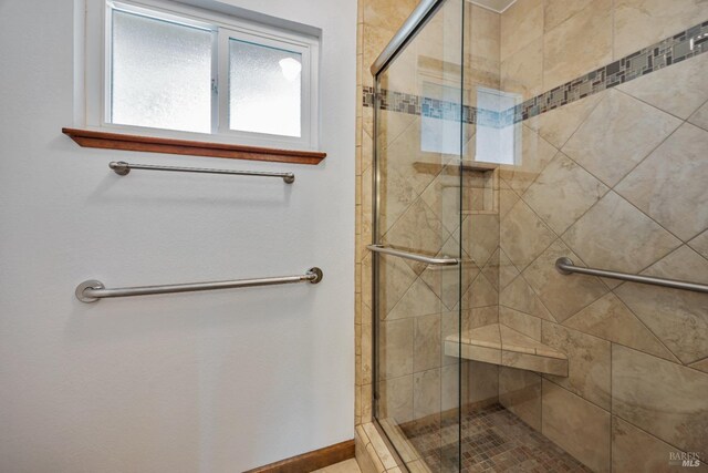 bathroom with a stall shower