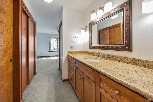 bathroom featuring vanity and baseboards