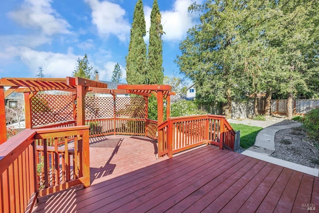 deck featuring a pergola and fence