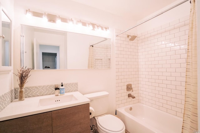 bathroom featuring decorative backsplash, shower / bath combination with curtain, toilet, and vanity