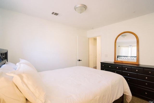 carpeted bedroom with visible vents