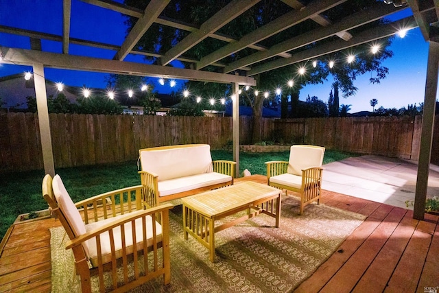 wooden terrace with an outdoor living space and a fenced backyard