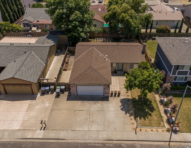 birds eye view of property with a residential view