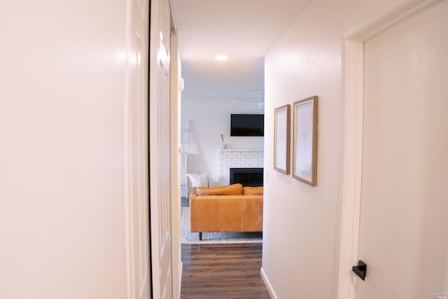 hall featuring dark wood-style floors and recessed lighting