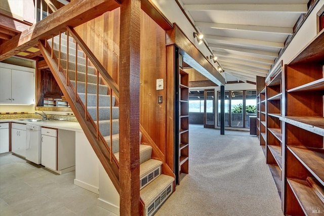 stairs featuring vaulted ceiling with beams and carpet