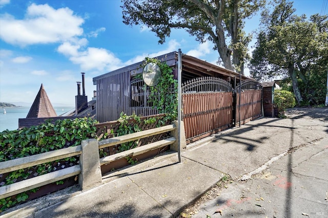 exterior space with fence and a gate