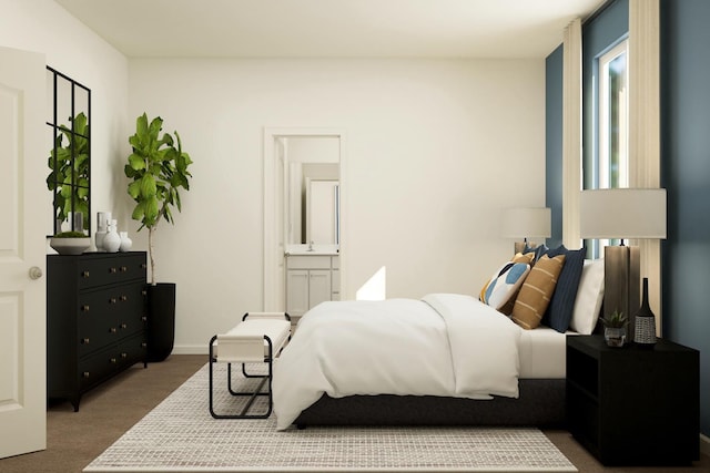 bedroom featuring connected bathroom and baseboards