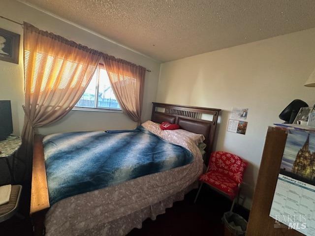 bedroom with a textured ceiling