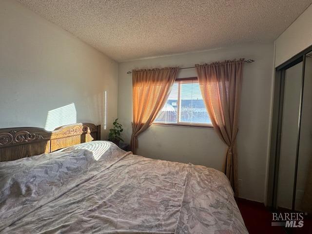 bedroom featuring a textured ceiling