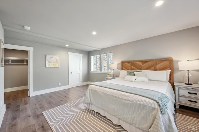 3292 Holland Dr, Santa Rosa, CA 95404 - bedroom with recessed lighting, a walk in closet, baseboards, and wood finished floors
