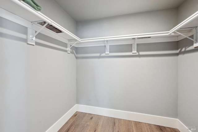 3292 Holland Dr, Santa Rosa, CA 95404 - walk in closet featuring wood finished floors and visible vents