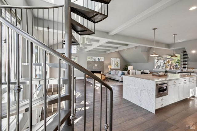 3292 Holland Dr, Santa Rosa, CA 95404 - stairway featuring hardwood / wood-style flooring, beamed ceiling, and a fireplace