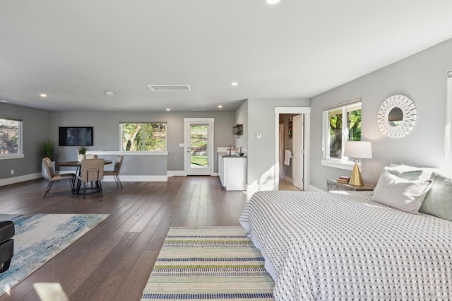 3292 Holland Dr, Santa Rosa, CA 95404 - bedroom with baseboards, wood-type flooring, multiple windows, and access to exterior