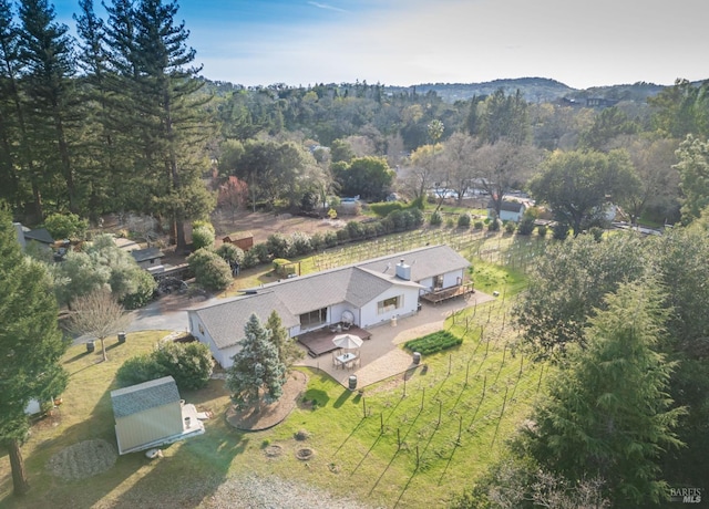 bird's eye view featuring a forest view