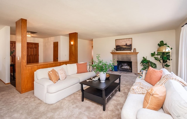 living room with carpet flooring, a fireplace, and visible vents