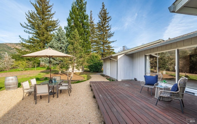 deck featuring outdoor dining space