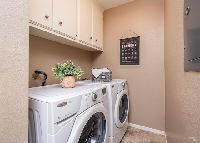 clothes washing area featuring cabinet space, independent washer and dryer, and baseboards