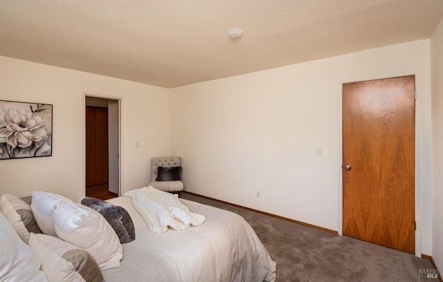 bedroom with baseboards and carpet flooring