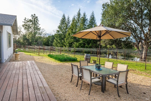 exterior space with outdoor dining area and a fenced backyard