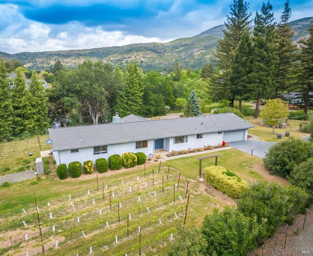 birds eye view of property featuring a mountain view