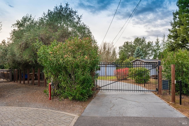 view of gate featuring fence