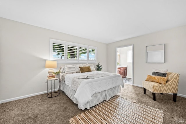 bedroom with carpet flooring, ensuite bath, and baseboards