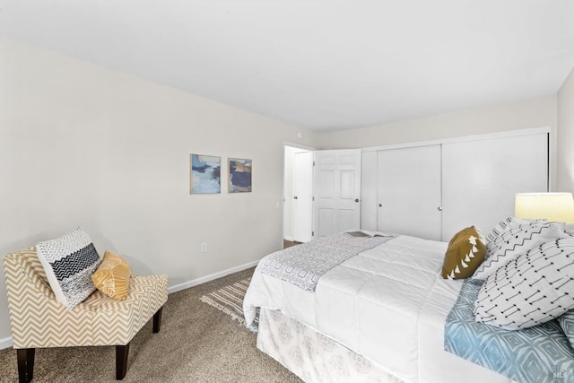 bedroom with carpet, baseboards, and a closet