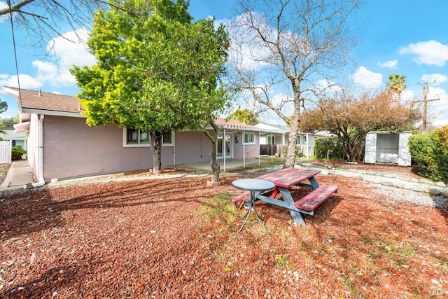 view of yard featuring a patio area and fence