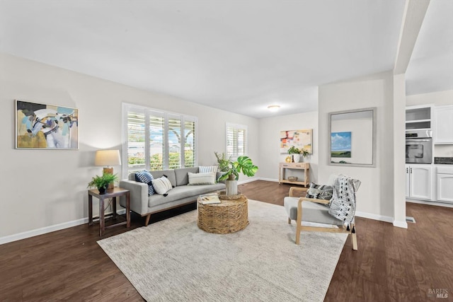 living room with baseboards and dark wood finished floors