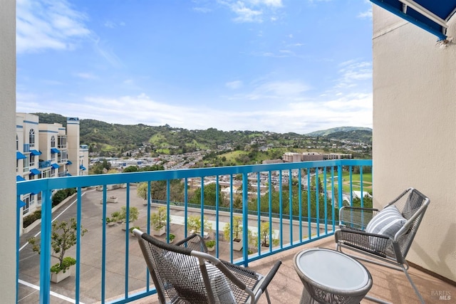 balcony featuring a mountain view