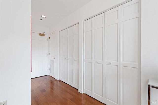 hallway featuring recessed lighting and wood finished floors