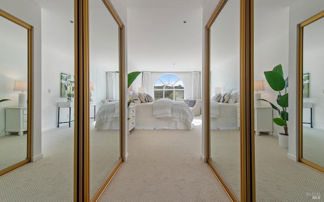 corridor with light colored carpet