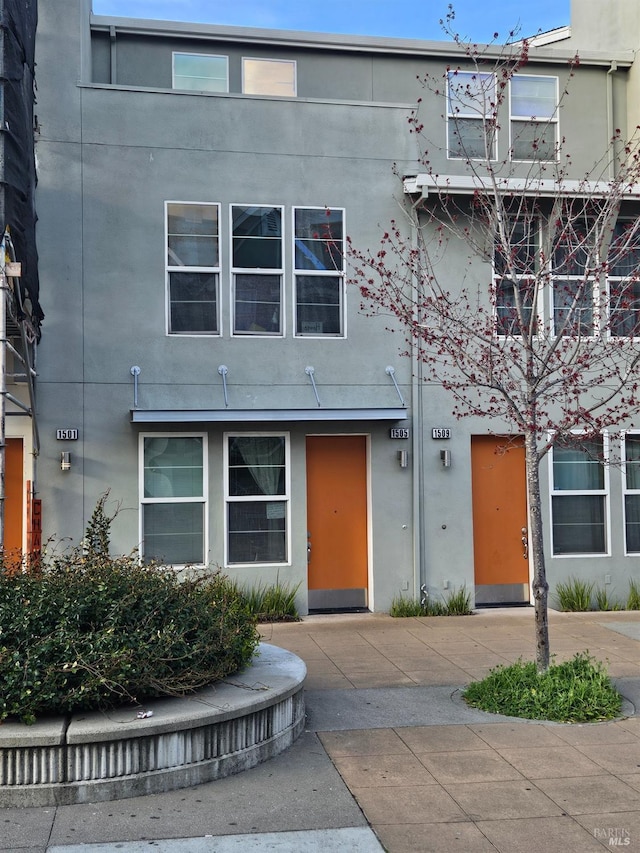 townhome / multi-family property with stucco siding